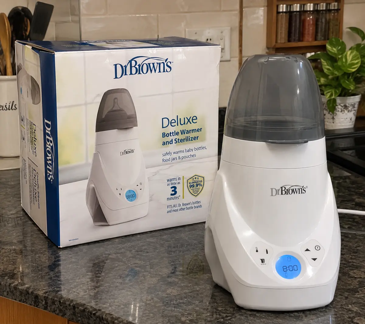 The Dr. Brown's Deluxe bottle warmer in use, shared by a parent who uses it