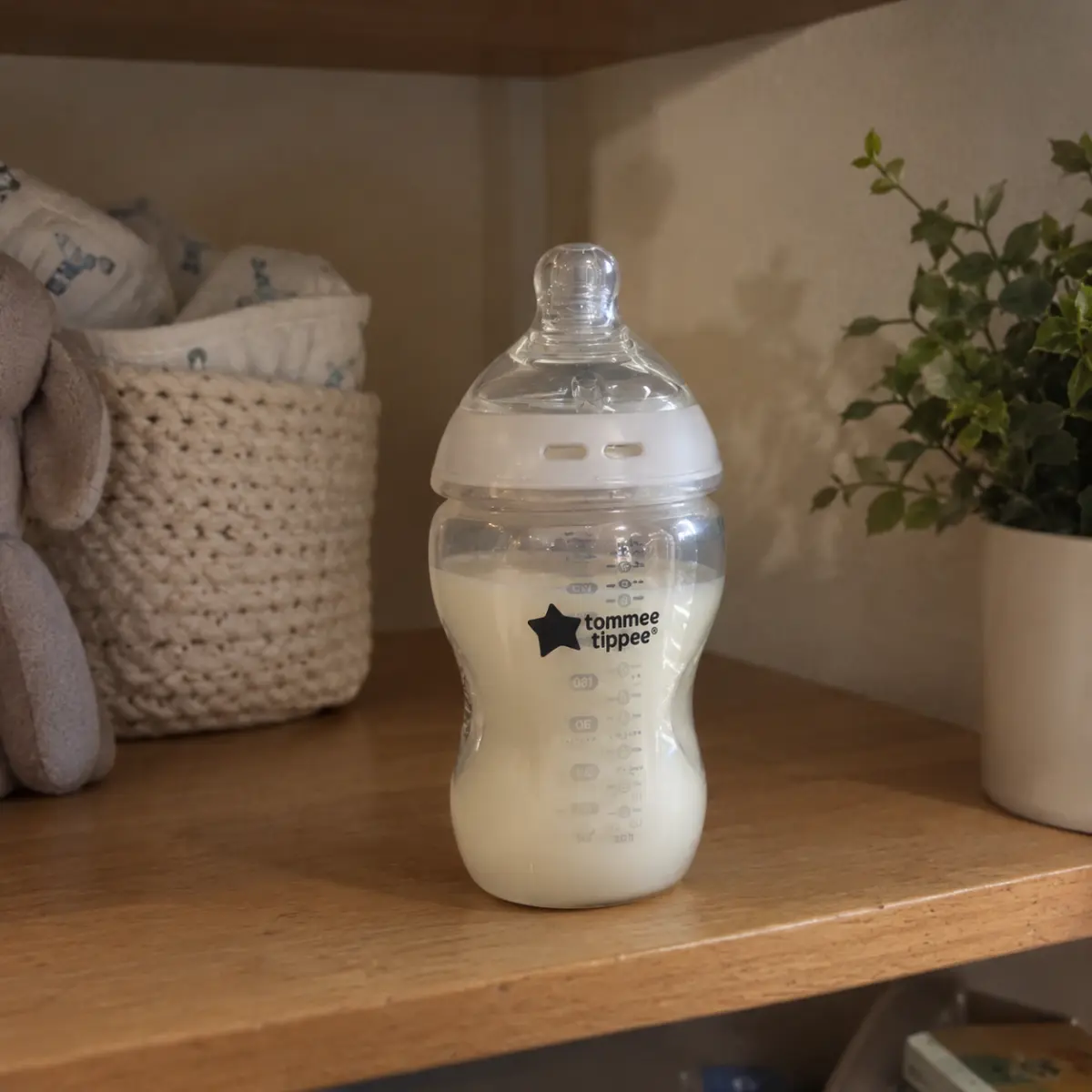 Our Tommee Tippee Natural Start glass bottle, made up and sitting on the nursery shelf, original photo